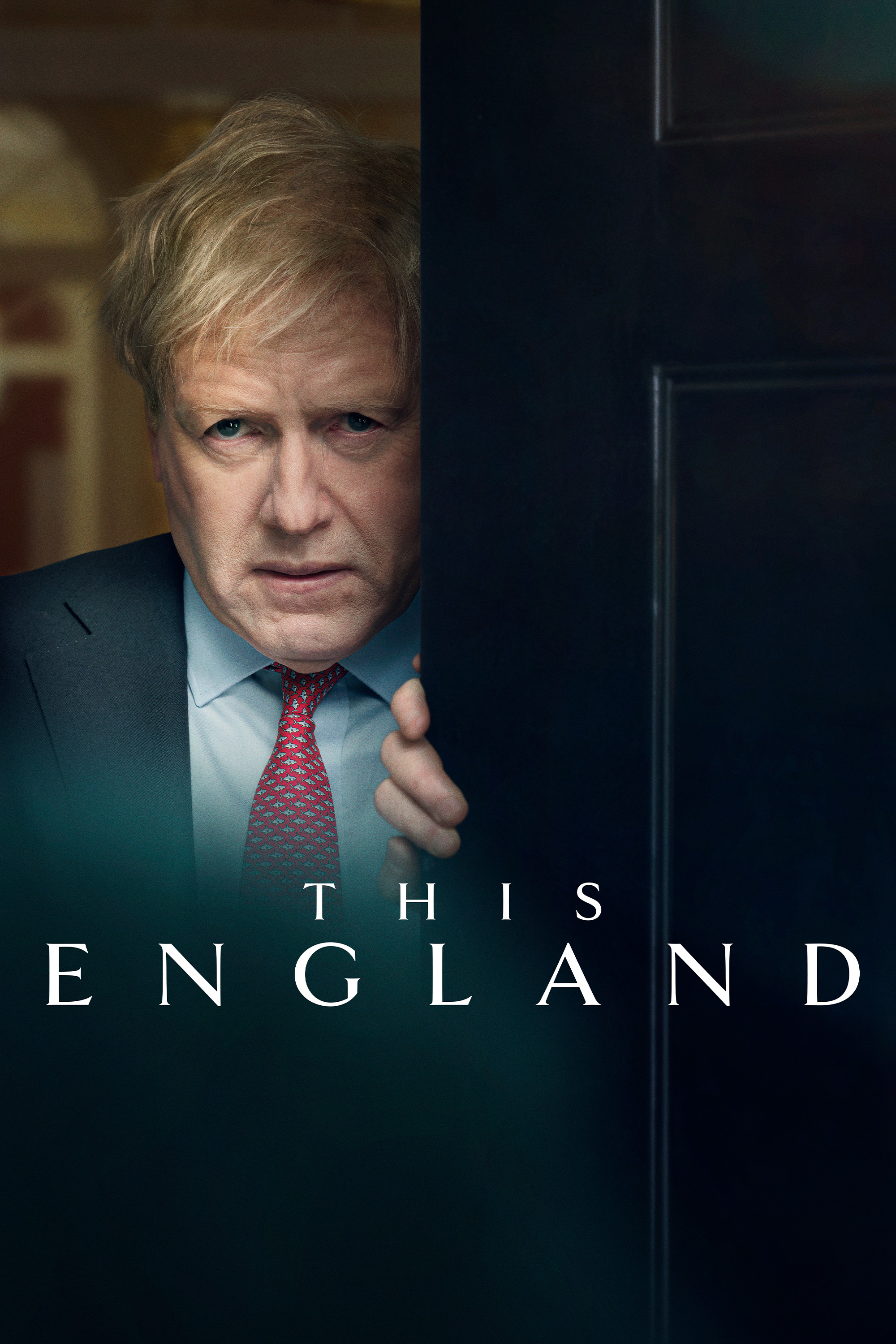 Poster for This England showing a close-up of Kenneth Branagh as Boris Johnson peering through a cracked-open dark door.
