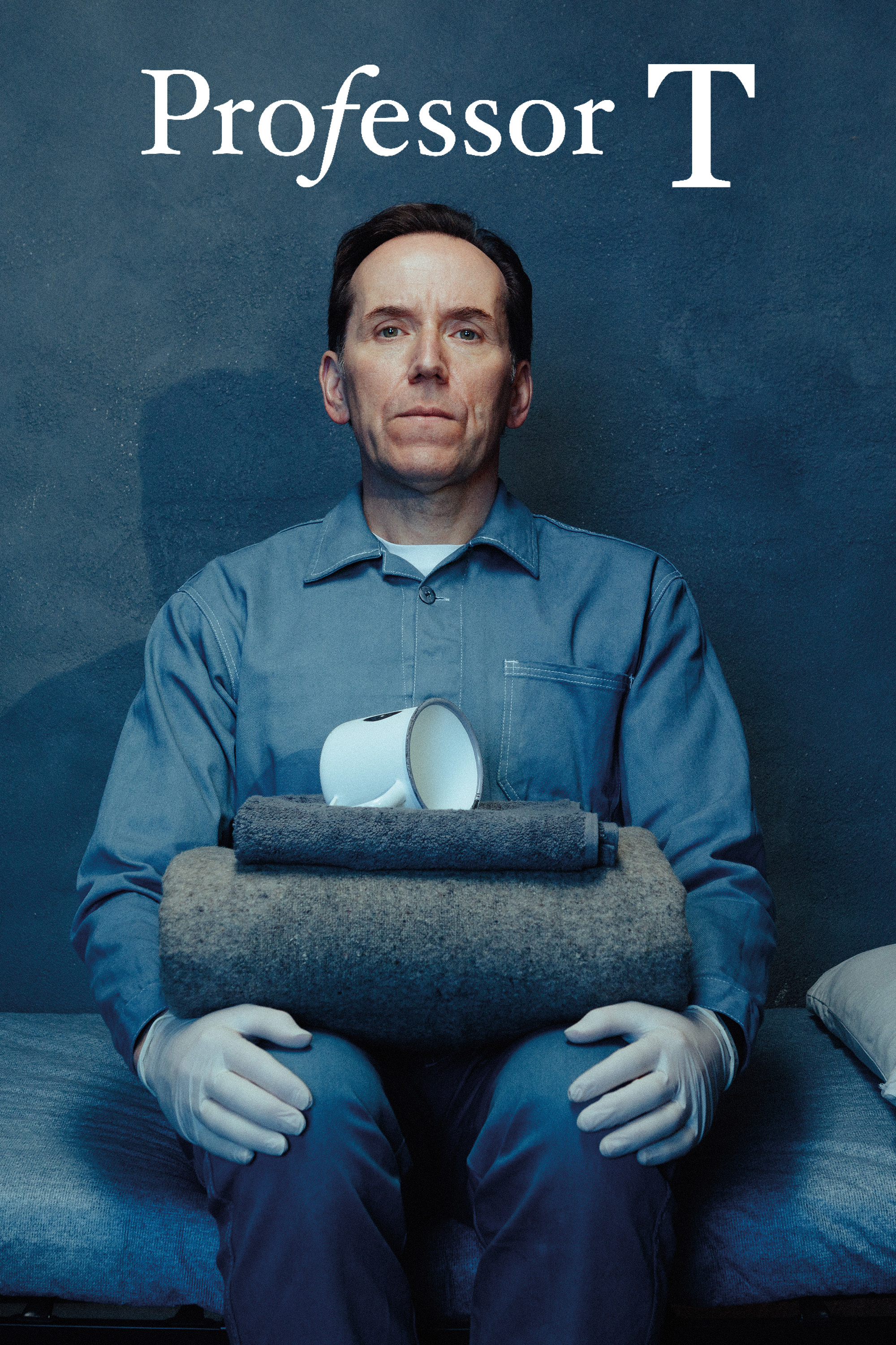 The image features promotional artwork for the television series Professor T. The title is displayed prominently in a stylized font