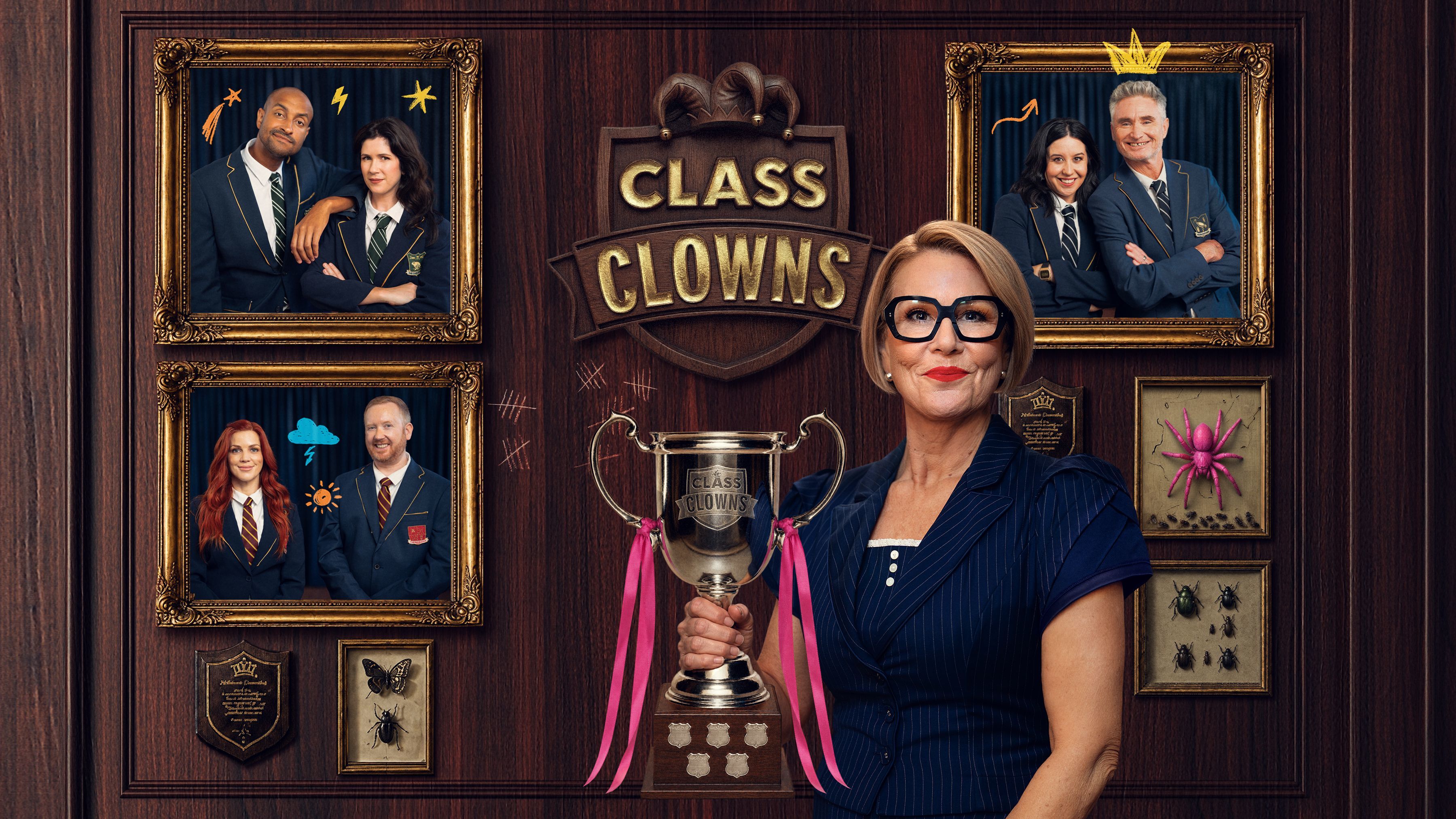Promotional poster for Class Clowns, showing host Julia Morris holding the Class Clowns Cup, surrounded by framed photos of comedian pairs Matt Okine and Becky Lucas, Dave Hughes and Nina Oyama, and Bron Lewis and Luke McGregor.