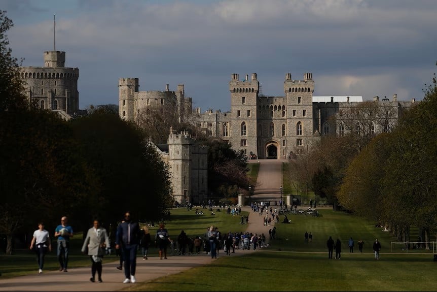 Beautiful castle with many people walking around
